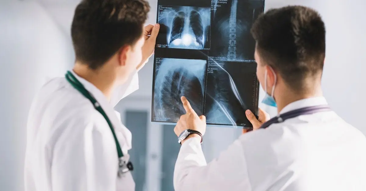 2 male doctors reviewing x-ray results