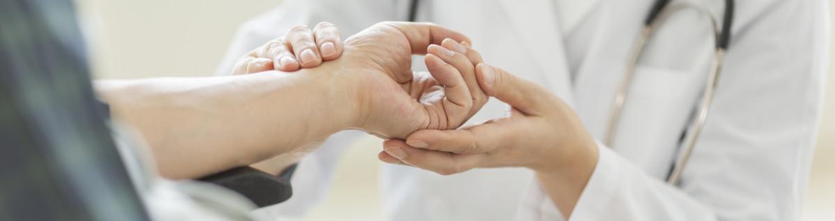 Doctor checking patient's pulse