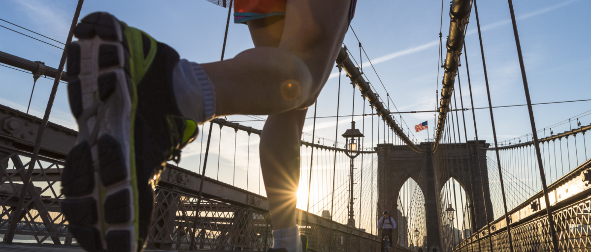 Man running along bridge in NYC